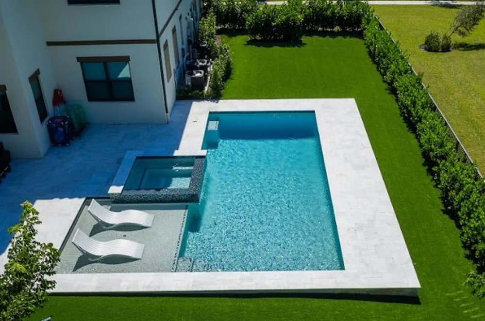 Rectangular pool with sun shelf and artificial turf