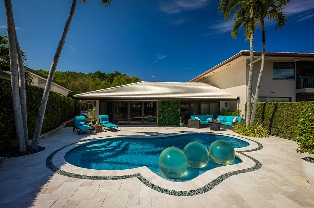 Freeform pool with spa and paver deck