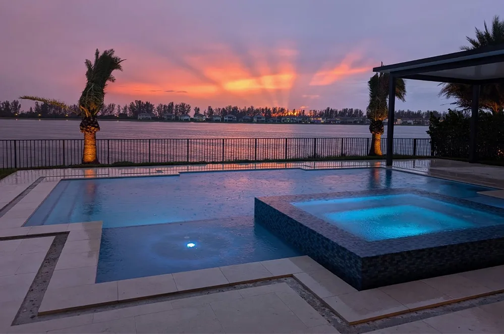 Pool and spa at sunset on the waterfront