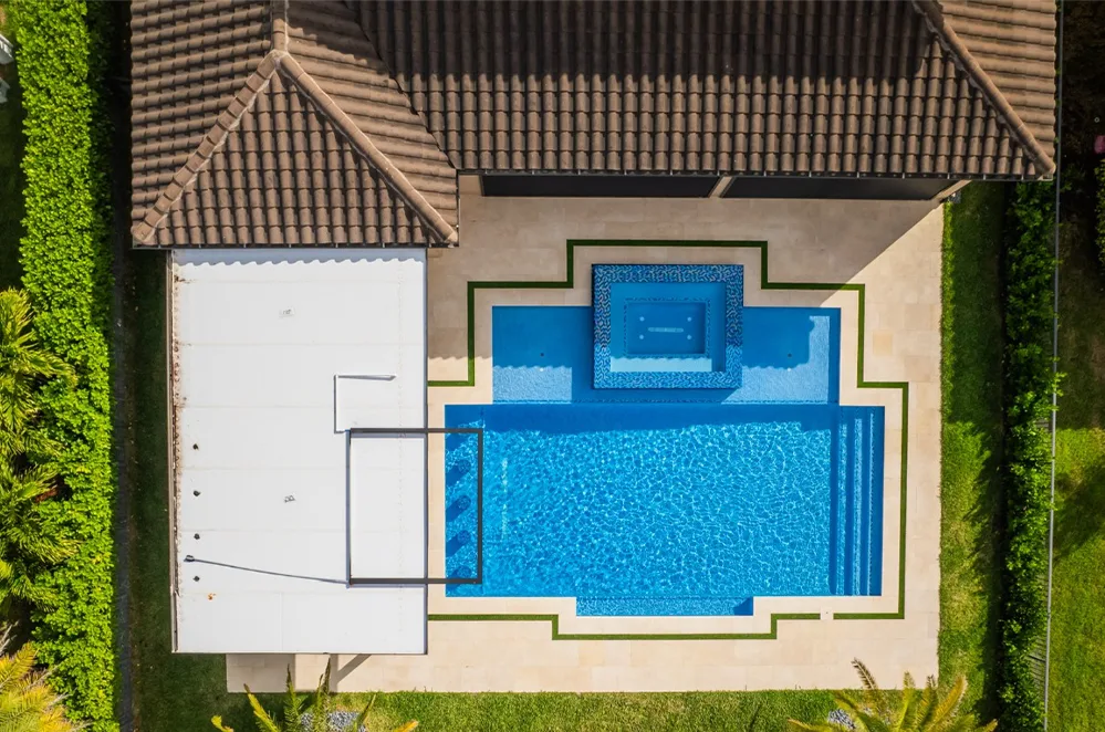 Aerial view of a rectangular pool with spa